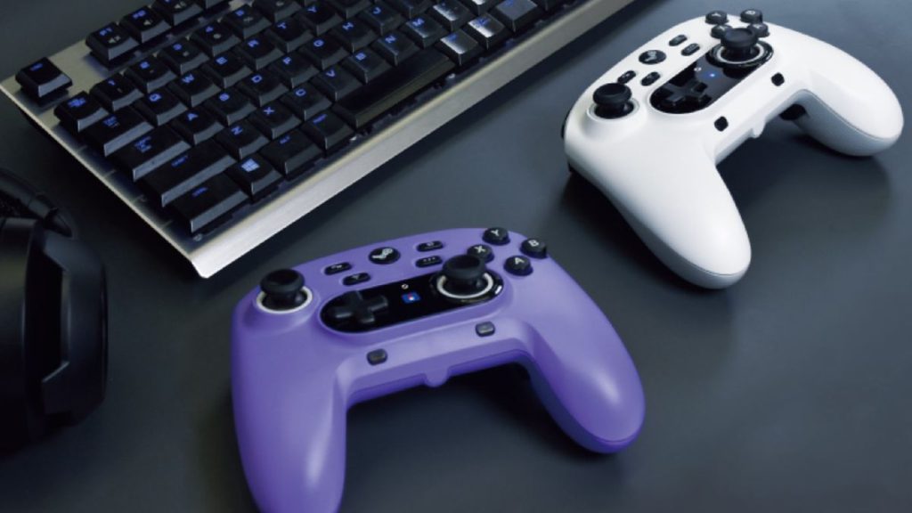 Two Steam-branded Hori controllers on a desk by a keyboard
